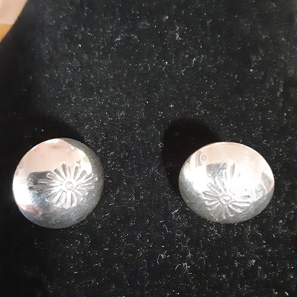 Sterling silver posts.  Shiny and simple design.